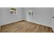 Clean, bright bedroom with natural light and wood-look floors at 7601 Aviano Ave, Orlando, FL 32819