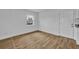 Bedroom with modern flooring, neutral paint, with a door to the hallway at 7601 Aviano Ave, Orlando, FL 32819