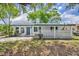 Charming single-story home with a well-maintained front yard and distinctive concrete privacy wall at 7601 Aviano Ave, Orlando, FL 32819