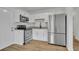 Bright kitchen features stainless steel appliances, granite countertops, and white cabinetry at 7601 Aviano Ave, Orlando, FL 32819