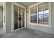 A balcony with a view of palm trees and the nearby community at 8192 Boat Hook Loop # 205, Windermere, FL 34786