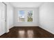 Bright and airy bedroom with hardwood floors and two windows at 8192 Boat Hook Loop # 205, Windermere, FL 34786