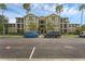 Beautiful building exterior with manicured landscaping and plentiful parking spaces at 8192 Boat Hook Loop # 205, Windermere, FL 34786