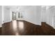Bright living area features hardwood floors, ceiling fan, and sliding glass door to balcony at 8192 Boat Hook Loop # 205, Windermere, FL 34786
