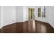 Cozy living room features hardwood floors and a sliding door that fills the room with light at 8192 Boat Hook Loop # 205, Windermere, FL 34786
