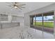 Open-concept living room featuring a marble island, modern cabinets, and sliding glass doors to the lake view at 10117 Atwater Bay Dr, Winter Garden, FL 34787