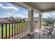 Enjoy views of the community park from the relaxing private balcony with seating at 11158 Hollow Bay Dr, Winter Garden, FL 34787