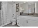A bathroom with a tub-shower combo, marble-like shower curtain, and vanity at 11158 Hollow Bay Dr, Winter Garden, FL 34787
