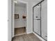 A bathroom with a glass-enclosed shower and a view of a walk-in closet at 11158 Hollow Bay Dr, Winter Garden, FL 34787