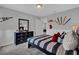 A bedroom featuring baseball-themed decor, complemented by a window view at 11158 Hollow Bay Dr, Winter Garden, FL 34787