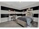 Stylish bedroom featuring modern black and white stripes, sleek silver furniture, and coordinated decor at 11158 Hollow Bay Dr, Winter Garden, FL 34787