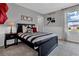 A bedroom featuring baseball-themed decor, complemented by a window view at 11158 Hollow Bay Dr, Winter Garden, FL 34787