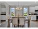 Elegant dining room with ample natural light and views, perfect for Gathering meals and entertaining at 11158 Hollow Bay Dr, Winter Garden, FL 34787