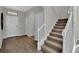 Welcoming entryway with a staircase and tile flooring, offering a glimpse into the home's layout at 11158 Hollow Bay Dr, Winter Garden, FL 34787
