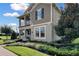 Charming two-story home with a covered porch, well-maintained landscaping, and a mix of textures at 11158 Hollow Bay Dr, Winter Garden, FL 34787