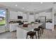 Bright kitchen with granite countertops, stainless steel appliances, and a central island with seating at 11158 Hollow Bay Dr, Winter Garden, FL 34787