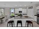Well-lit kitchen with a large island, granite countertops, and modern appliances at 11158 Hollow Bay Dr, Winter Garden, FL 34787
