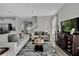 Open-concept living area with a staircase, stylish furnishings, and lots of natural light at 11158 Hollow Bay Dr, Winter Garden, FL 34787