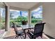Covered outdoor patio with seating area, perfect for relaxing and enjoying the view at 11158 Hollow Bay Dr, Winter Garden, FL 34787
