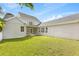 Expansive backyard with a well-maintained lawn and exterior view of the home at 11333 Camden Park Dr, Windermere, FL 34786