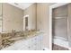 Bathroom featuring double sinks with granite countertops and a tiled bath/shower at 11333 Camden Park Dr, Windermere, FL 34786