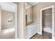 Well-lit bathroom vanity with marble countertop and an attached bath/shower at 11333 Camden Park Dr, Windermere, FL 34786