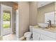 Modern bathroom featuring a vessel sink, granite countertop and walk-in glass shower at 11333 Camden Park Dr, Windermere, FL 34786
