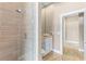 Bathroom with tiled shower, granite vanity top, and modern fixtures at 11333 Camden Park Dr, Windermere, FL 34786