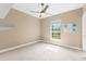 Bedroom with ceiling fan and a window that allows for natural light at 11333 Camden Park Dr, Windermere, FL 34786