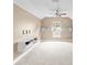 Bonus room with carpet, ceiling fan, vaulted ceiling and custom wall unit at 11333 Camden Park Dr, Windermere, FL 34786