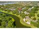 Aerial view of a neighborhood with a waterfront and lush greenery at 11333 Camden Park Dr, Windermere, FL 34786