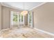 Bright dining room featuring stone flooring, large windows, and neutral paint at 11333 Camden Park Dr, Windermere, FL 34786