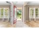 Open foyer featuring stone flooring, large windows, and natural light at 11333 Camden Park Dr, Windermere, FL 34786