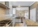 This spacious kitchen features stainless steel appliances, an island, and a view into the living room at 11333 Camden Park Dr, Windermere, FL 34786