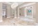 Spacious living room with stone flooring, neutral walls, and ample natural light at 11333 Camden Park Dr, Windermere, FL 34786
