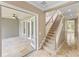 Elegant staircase with carpeted steps, and a neutral color palette at 11333 Camden Park Dr, Windermere, FL 34786