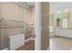 Walk-in closet leading to a bathroom with tub, sink, and vanity at 11333 Camden Park Dr, Windermere, FL 34786