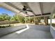 An open back patio with a ceiling fan, perfect for outdoor entertaining or relaxation at 116 Morning Glory Dr, Lake Mary, FL 32746
