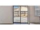 View of the backyard from a living area with glass sliding doors and hardwood flooring at 116 Morning Glory Dr, Lake Mary, FL 32746