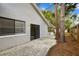 View of the rear exterior of the home, with the fenced-in side yard at 116 Morning Glory Dr, Lake Mary, FL 32746