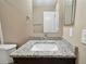 Bathroom features a granite vanity top and a stylish mirror at 116 Morning Glory Dr, Lake Mary, FL 32746