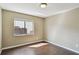 Bedroom featuring wood-look floors and a sunlit window at 116 Morning Glory Dr, Lake Mary, FL 32746