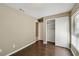 Bedroom featuring wood-look floors, and a closet with sliding doors at 116 Morning Glory Dr, Lake Mary, FL 32746