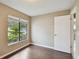 Bedroom with hardwood floors, tan walls and large window with blinds at 116 Morning Glory Dr, Lake Mary, FL 32746
