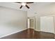 Spacious bedroom features hardwood floors, closet, and doorway to bathroom at 116 Morning Glory Dr, Lake Mary, FL 32746