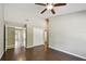 Spacious bedroom features hardwood floors, closet, doorway to bathroom, and ceiling fan at 116 Morning Glory Dr, Lake Mary, FL 32746
