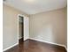 Bedroom with hardwood floors, and tan walls, closet with folding doors at 116 Morning Glory Dr, Lake Mary, FL 32746