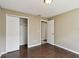 Bright bedroom with wood-look floors and a closet with sliding doors at 116 Morning Glory Dr, Lake Mary, FL 32746