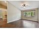 Spacious bedroom features large window and hardwood floors with closet and ceiling fan at 116 Morning Glory Dr, Lake Mary, FL 32746