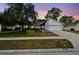 A charming single-Gathering home with a well-manicured lawn and attached two-car garage at 116 Morning Glory Dr, Lake Mary, FL 32746